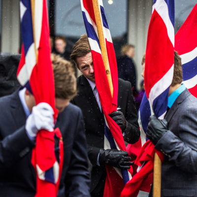 Young Standard Bearers Defying the Bad Weather in Svolvær, Lofoten